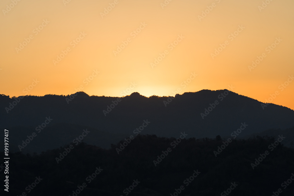 mountain ridge cut with orange twilight, Mae Sot, Thailand