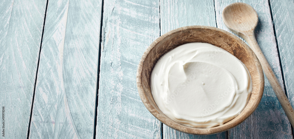 Rustic bowl of healthy natural Greek yogurt Rustic bowl of healthy natural Greek yogurt
