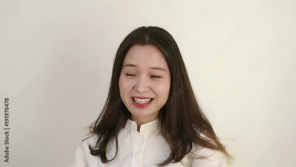 Young woman with white shirt and making funny expression of pretending to cry Young woman with white shirt and making funny expression of pretending to cry