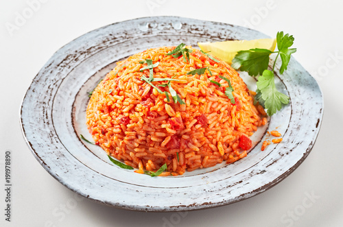 Serving of healthy nutritious Greek tomato pilaf photo