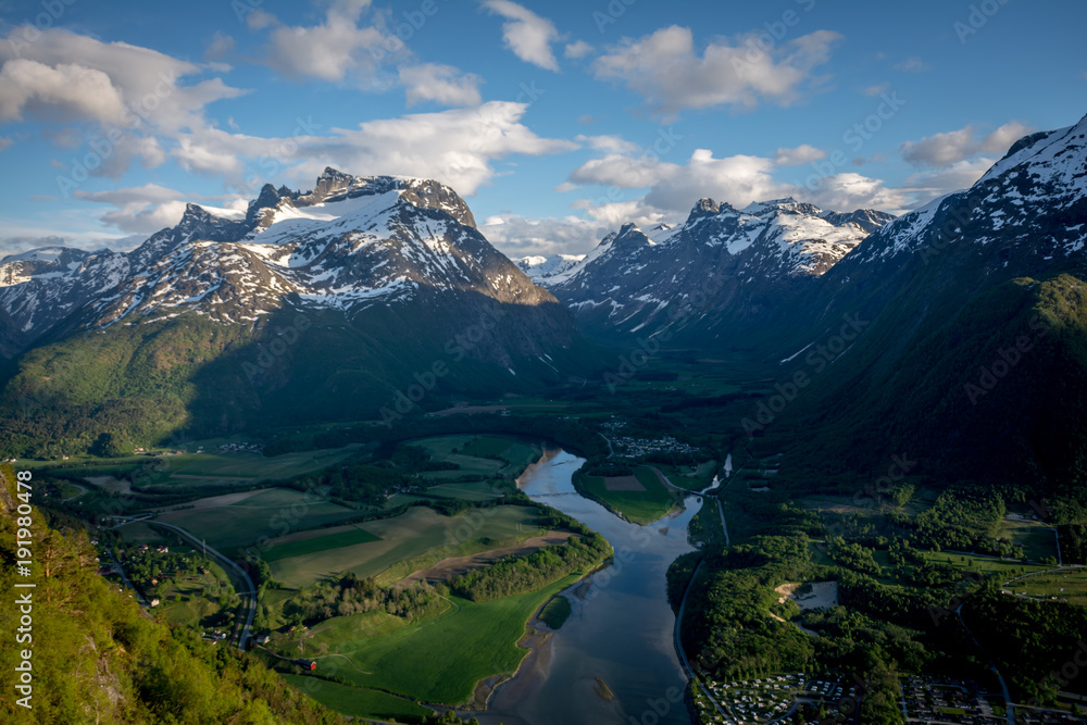 Beautiful view from the famous Rampestreken very close to the Nesakla peak, from where you can see the city Andalsnes city and the surroundings fjords and peaks.