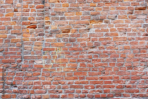Old texture of brown brick wall as background 