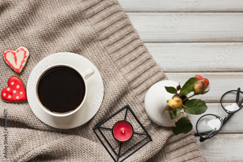 Box with a present to the Valentine's Day cookies in the shape of a heart and cups of black coffee photo