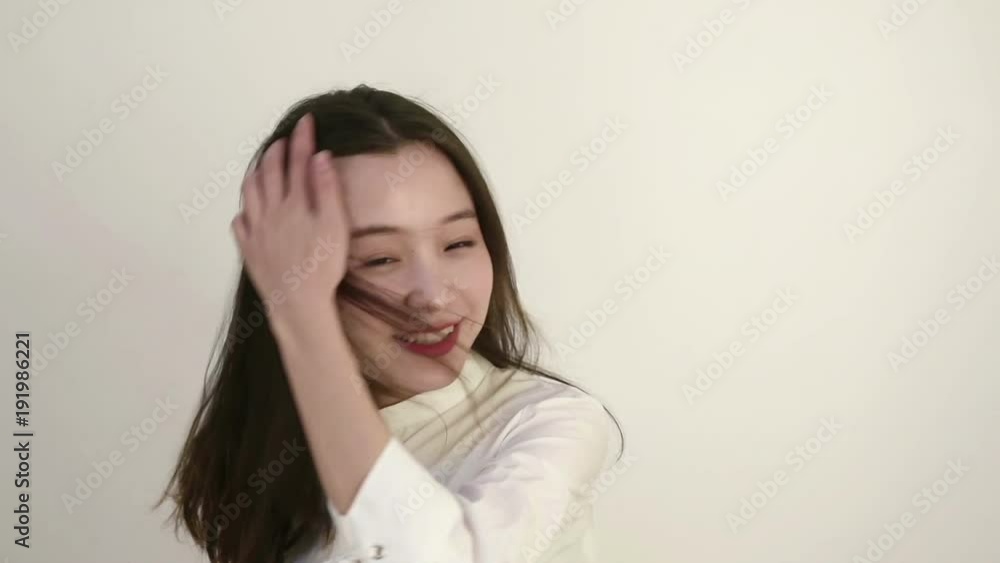 Beautiful young woman turning around and fluttering hair with wind. Slow motion.
Beautiful young woman turning around and fluttering hair with wind. Slow motion.