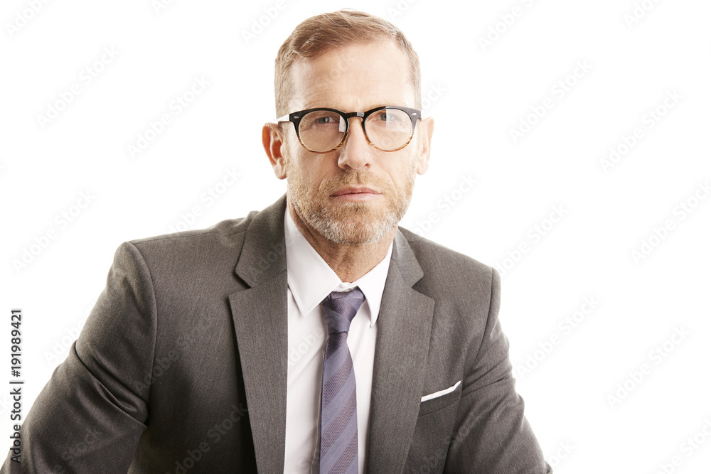 Smiling businessman portrait. Successful senior manager business man wearing suit while standing against at isolated white background. Smiling businessman portrait. Successful senior manager business man wearing suit while standing against at isolated white background.