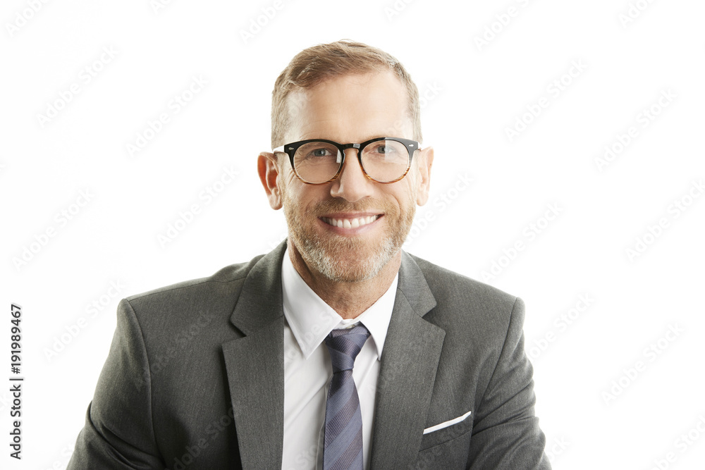 Smiling businessman portrait. Successful senior manager business man wearing suit while standing against at isolated white background. Smiling businessman portrait. Successful senior manager business man wearing suit while standing against at isolated white background.