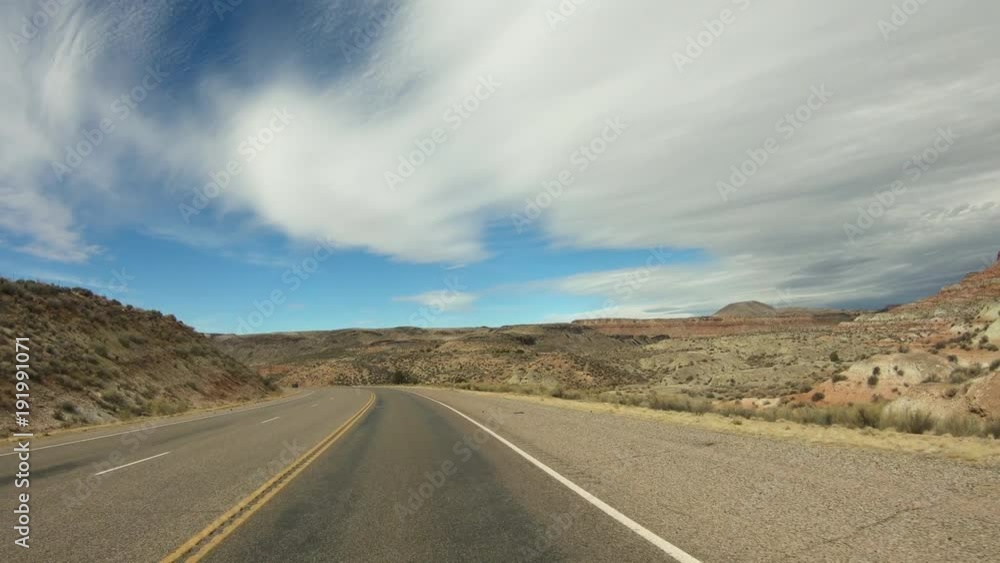 Southwest Utah desert highway hills traffic POV. Near St George. Geological landscape beautiful dry mountain valley. Driving point of view, POV Southwest Utah desert highway hills traffic POV. Near St George. Geological landscape beautiful dry mountain valley. Driving point of view, POV