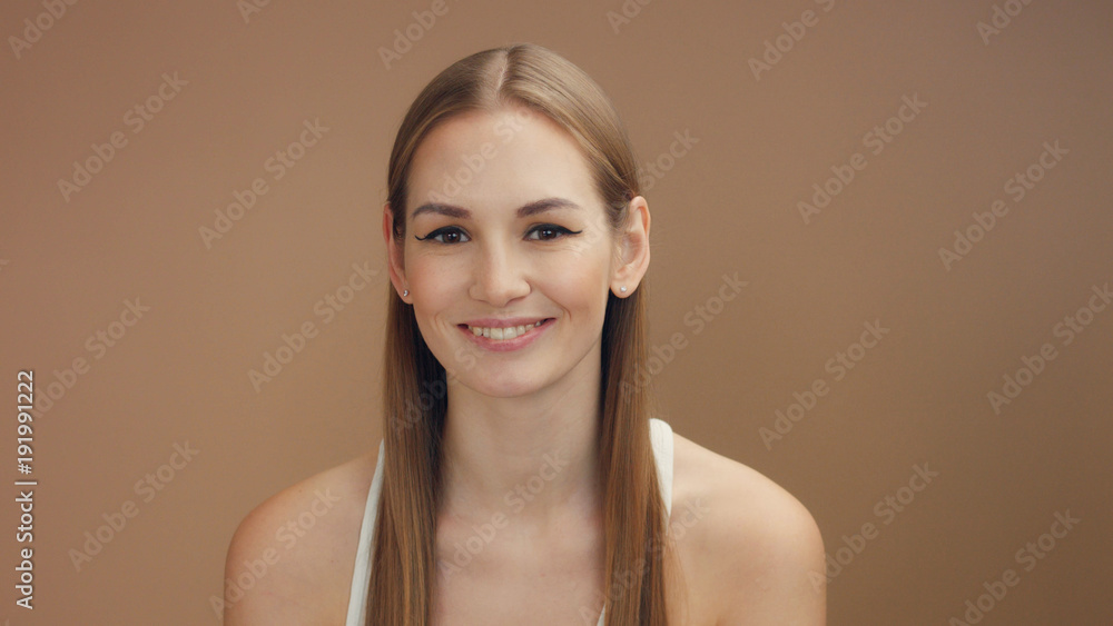 closeup portrait of blonde woman with straight long hair watching at camera closeup portrait of blonde woman with straight long hair watching at camera