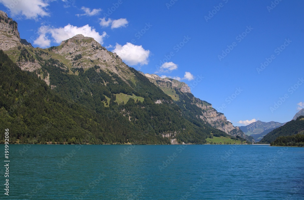 Turquoise lake Klontalersee in summer. Landscape in Glarus canton.