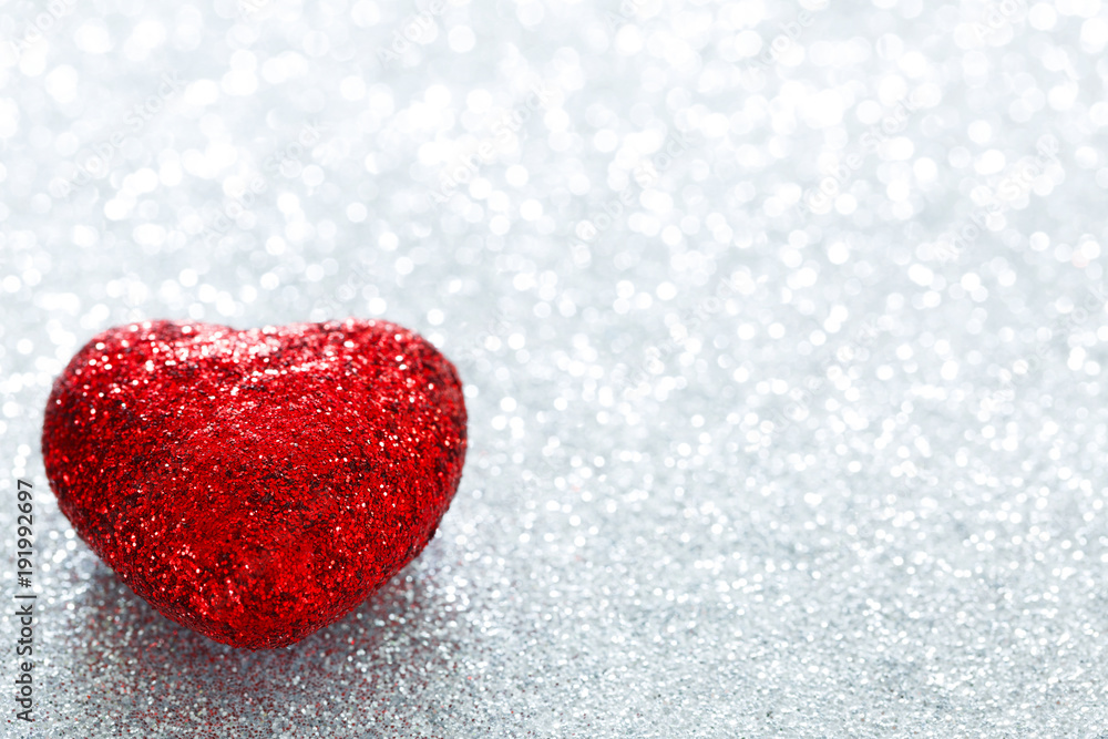 Brilliant red heart on a white bright background. Macro. Valentine's Day. Postcard. 14 February. Space for text