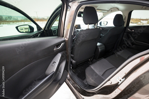 Black car interior with back seats © Patryk Kosmider