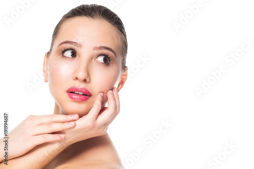 Beautiful woman looking up, side on white isolated background, horizontal. Fresh spring make up, pink lips, brunette. © liliyabatyrova