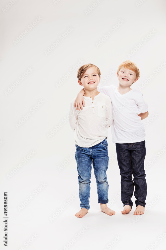 Studio portrait of two boys, full length Studio portrait of two boys, full length