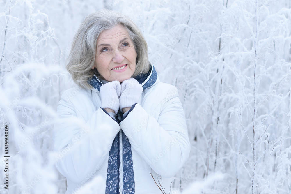 mature woman in winter posing outdoors mature woman in winter posing outdoors