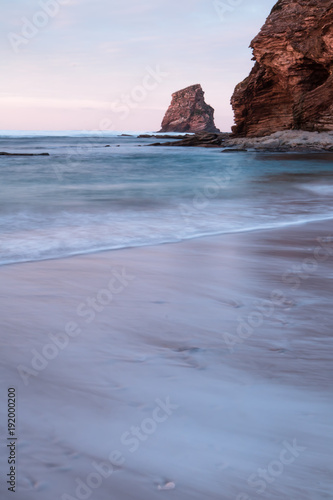 beautiful sandy beach on atlantic coastline in sunset, hendaye, basque country, france 