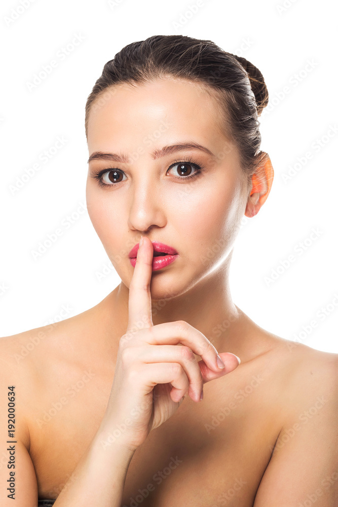 Beautiful brunette woman says it's a secret, Shh. Finger on lips. Beautiful brunette woman says it's a secret, Shh. Finger on lips.