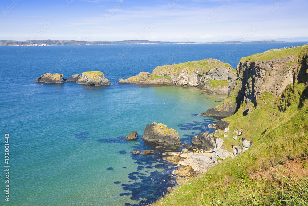 Irish landscape in northern Ireland with cliffs and calm sea in the summer season(County Antrim - United Kingdom)