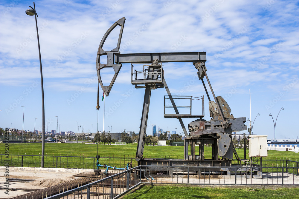 Oil pump pumping oil in former oil fields. Equipment of the oil industry. Baku, Azerbaijan, Oil pump pumping oil in former oil fields. Equipment of the oil industry. Baku, Azerbaijan,