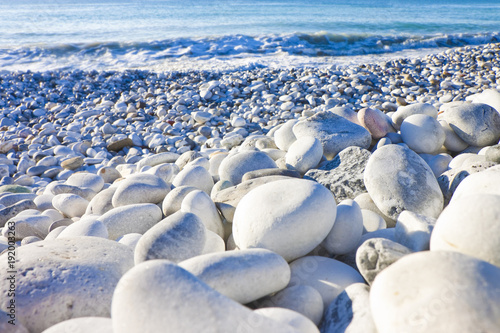 White and gray stones softly rounded and washed from sea water