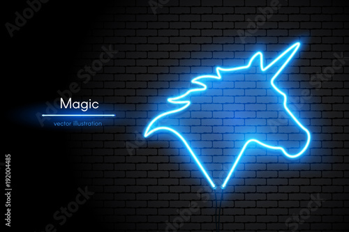Image of a Unicorn made of neon lamps on a background in the form of a dark brick wall. Hand of Horse with horn with bright neon light.