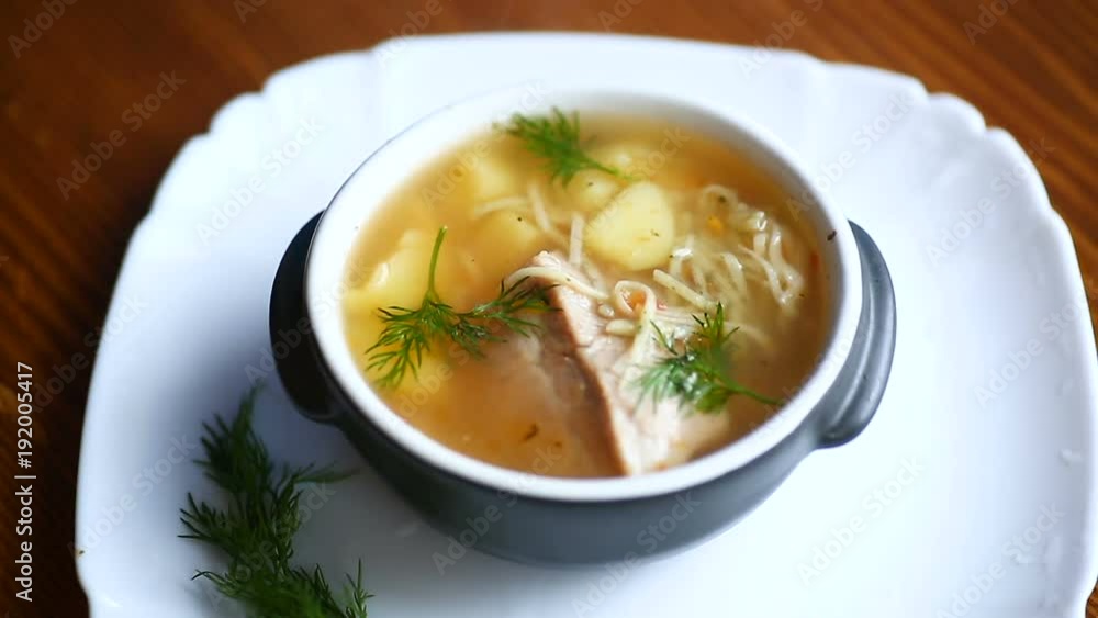 hot soup with homemade noodles in a bowl hot soup with homemade noodles in a bowl