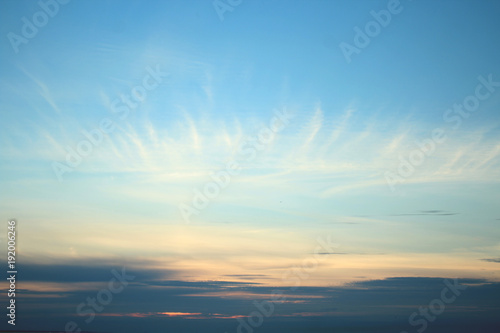 Cirrus clouds on a blue sunset sky © Vasya Sun