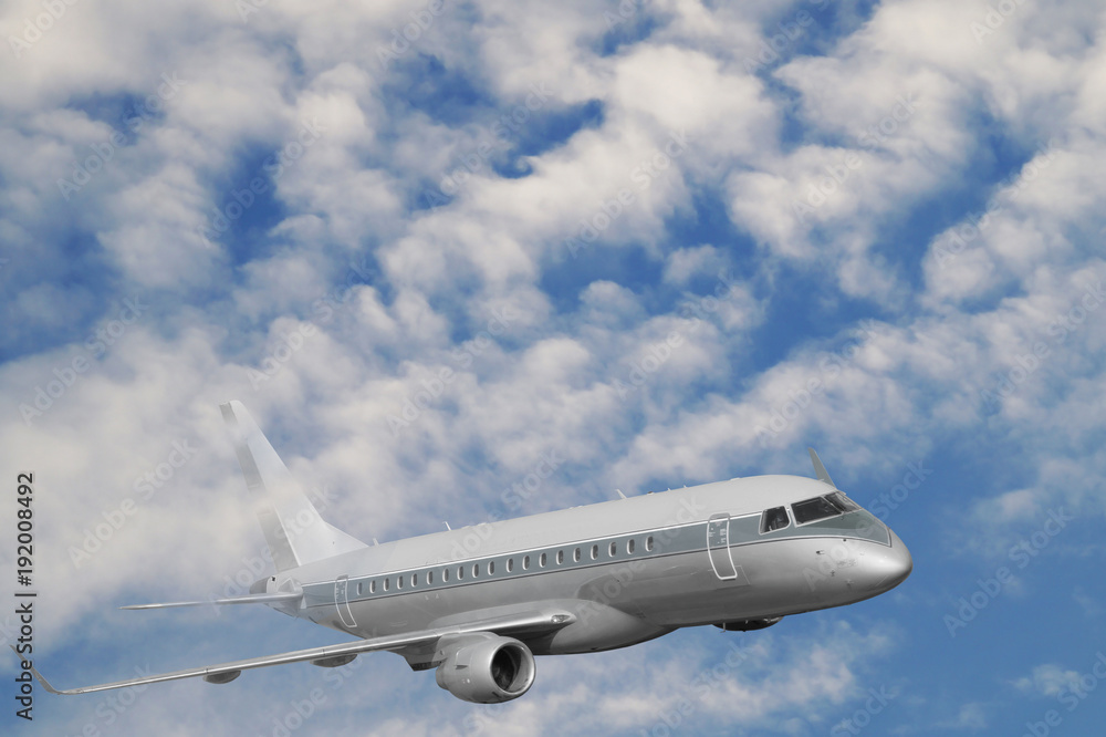 Fototapeta premium The passenger plane during the flight rises above the cloud level