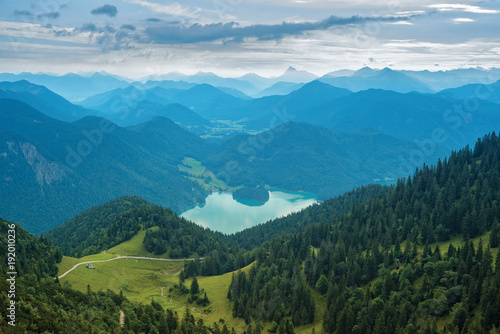 Mountain view with forests  green meadows and Walchensee lake