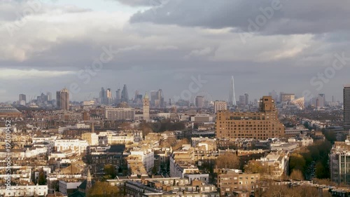 Rising aerial establishing shot of Kensington, Hyde Park and London cityscape photo