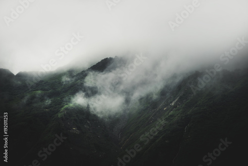 Low lying cloud and fog rolling in on a mountain