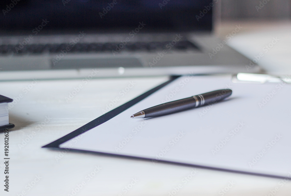 laptop and documents in the workplace. laptop and documents in the workplace.