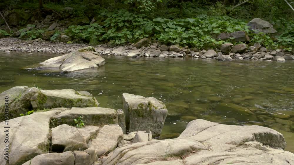 Sliding video along the river flow of the mountain river in canyon Sliding video along the river flow of the mountain river in canyon
