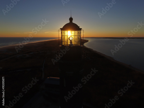 Sunrise Thru a Lifgthouse Light photo