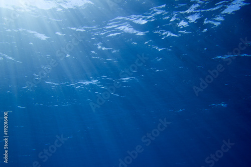 Sunbeams in the blue water 