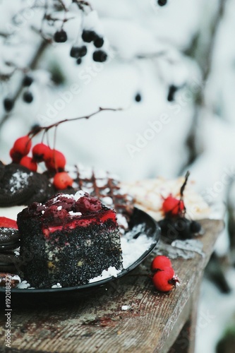 cake in nature, winter background, winter and sweets, cherry cake