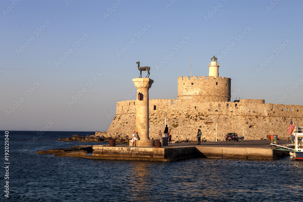 Statues at the entrance to the harbor of Rhodes, Greece