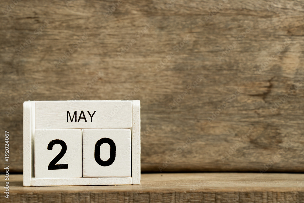 White block calendar present date 20 and month May on wood background White block calendar present date 20 and month May on wood background