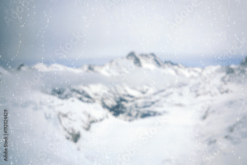 View through the window with rain drop on the Eismeer glacier from the Jungfrau railway in Switzerland. © flowertiare
