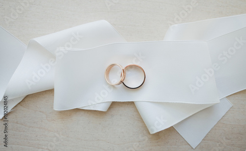 two golden wedding rings on drapery © jozzeppe777