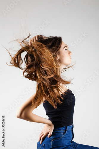 beautiful brunette girl with windy hair