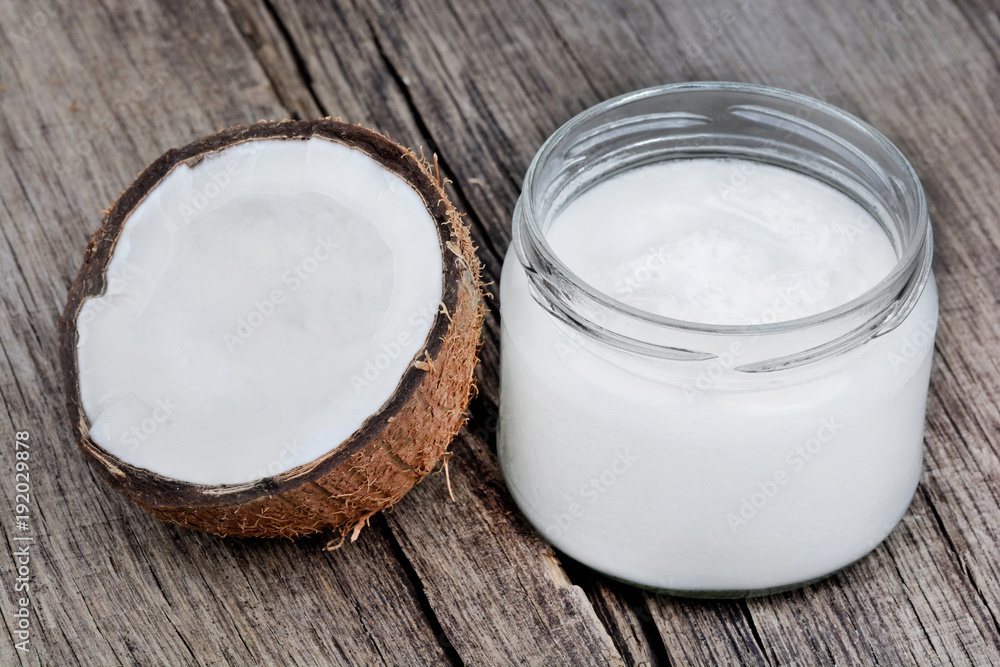 Coconut oil in glassware on table Coconut oil in glassware on table