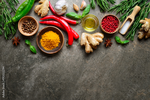 Spices, herbs and various other culinary ingredients background photo