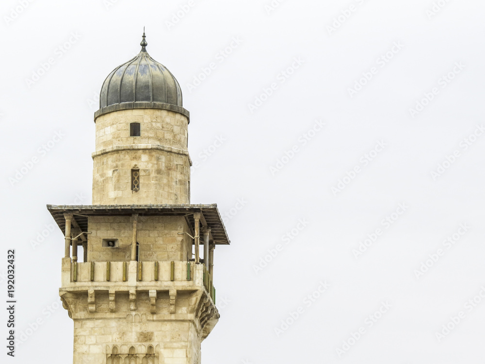 Jerusalem, Israel -   The  tall minaret of the Al-Aqsa Mosque in the Temple Mount in the Old City of Jerusalem, Israel
