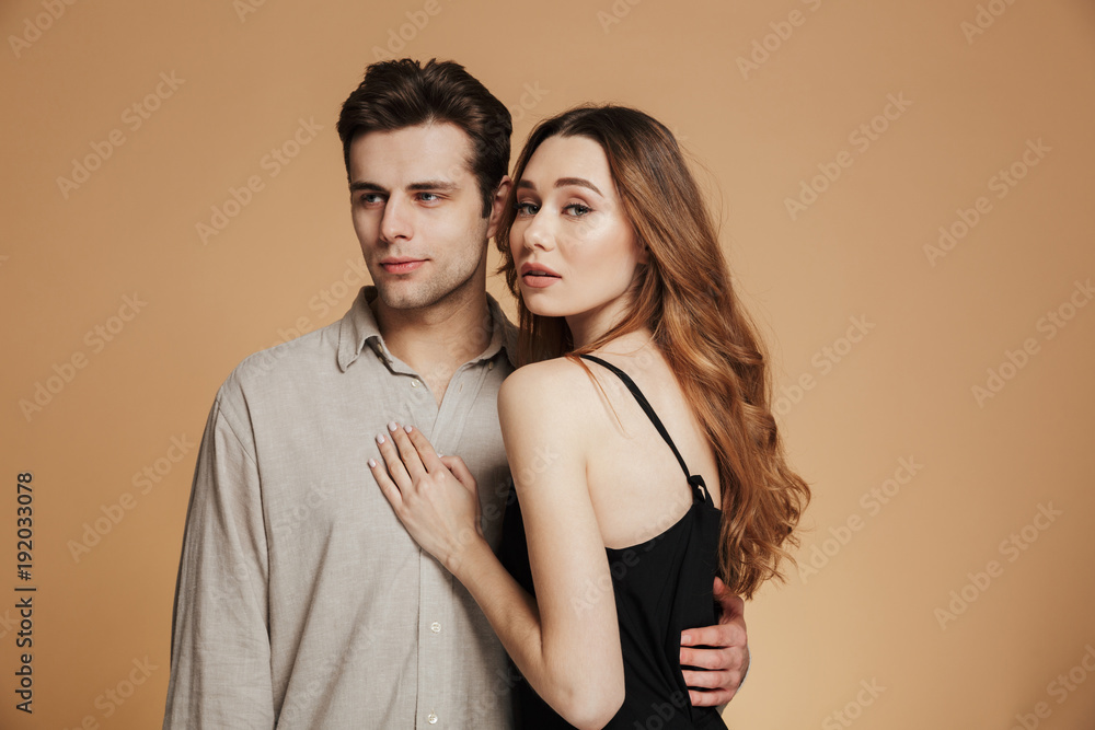 Portrait of a beautiful young couple hugging Portrait of a beautiful young couple hugging