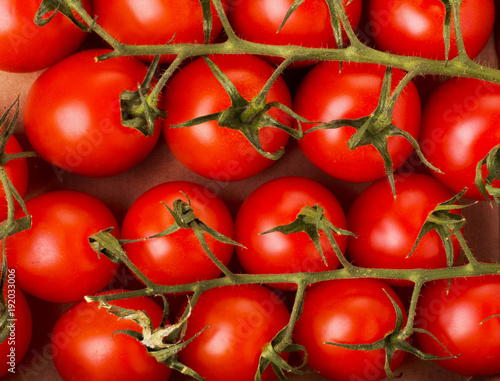 Small red cherry tomatoes on a box