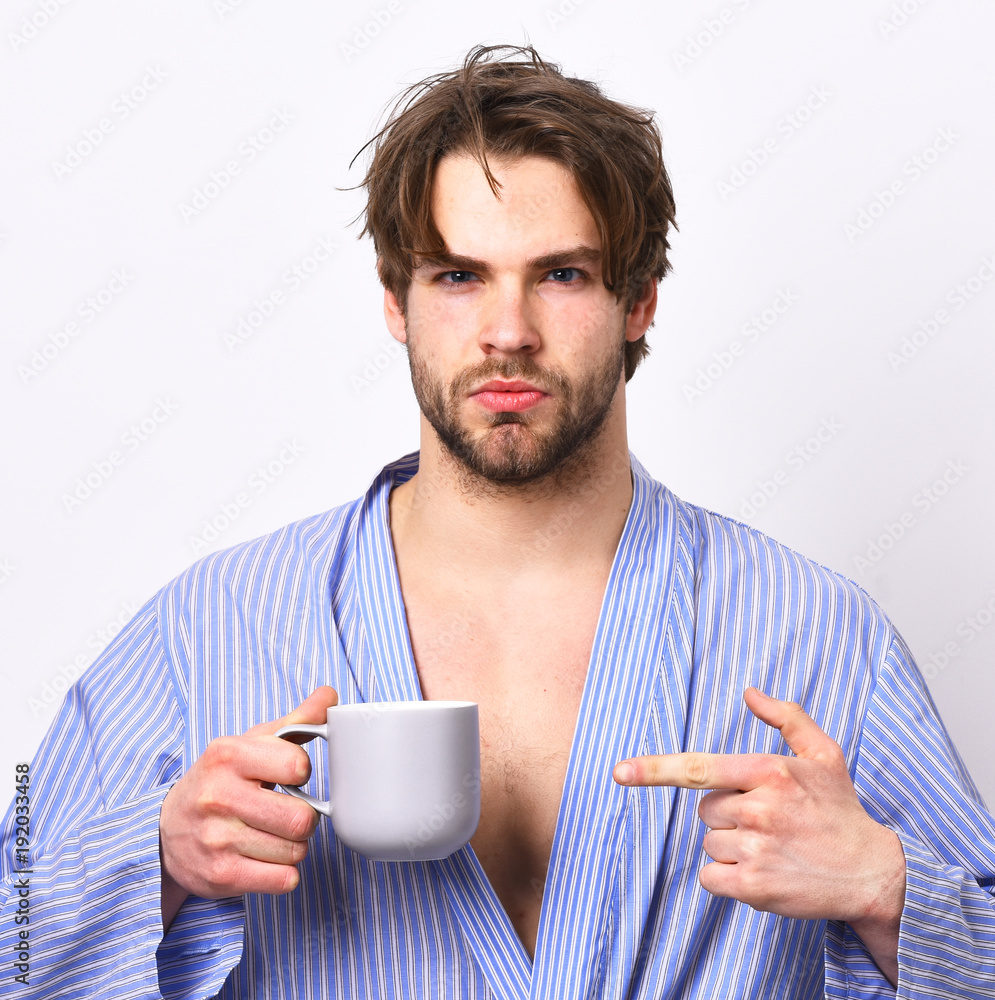 Man with beard in blue dressing gown on grey background. Man with beard in blue dressing gown on grey background.