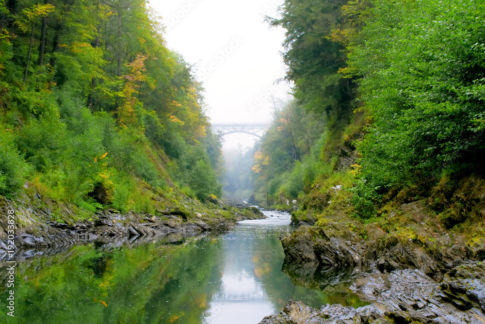 Quechee bridge in fog sits over the Quechee Gorge Quechee bridge in fog sits over the Quechee Gorge