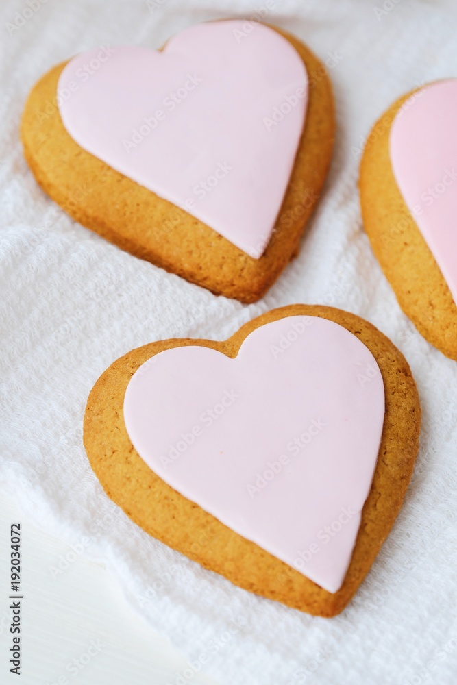 Delicious fresh heart cookies with pink glaze Delicious fresh heart cookies with pink glaze