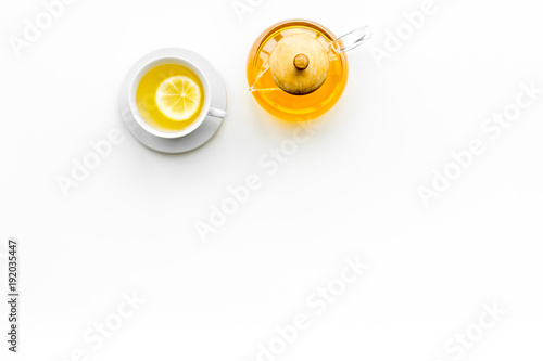 Warming tea with lemon and ginger on white background top view copy space