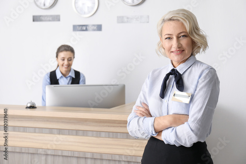 Female hotel receptionist a...